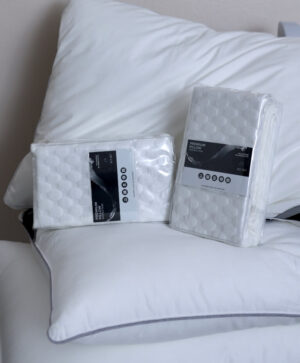 premium pillow protector with breathable, moisture-wicking cotton surface, shields against sweat, spills, and allergens.